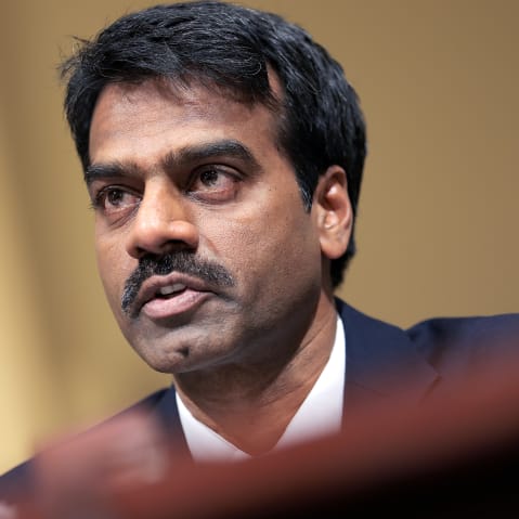 Madhu Gottumukkala's face is seen in a closeup frame-shot from below and diagonally.