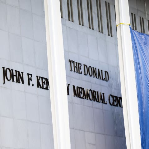 Workers adjust the name of the &ldquo;John F. Kennedy Memorial Center for the Performing Arts" on Dec. 19, 2025 in Washington, D.C.