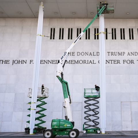 Construction people unveil new signage for the newly renamed The Donald J. Trump and The John F. Kennedy Memorial Center For The Performing Arts.