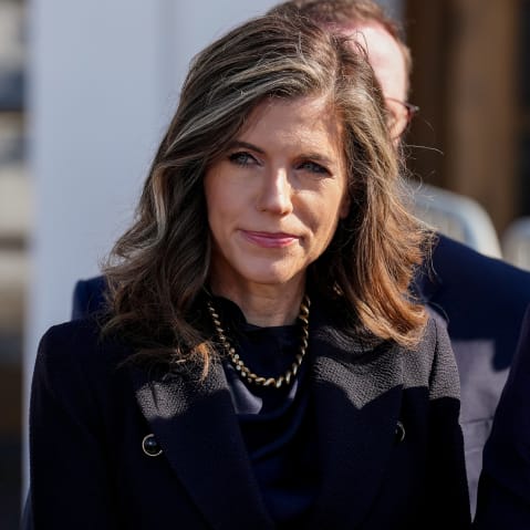 Nancy Mace is standing among other politicians outside.