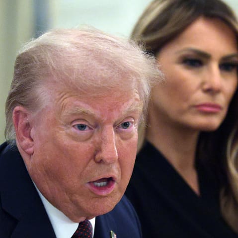 President Donald Trump speaks as first lady Melania Trump listens on Sept. 4, 2025, during a dinner at the State Dining Room of the White House.