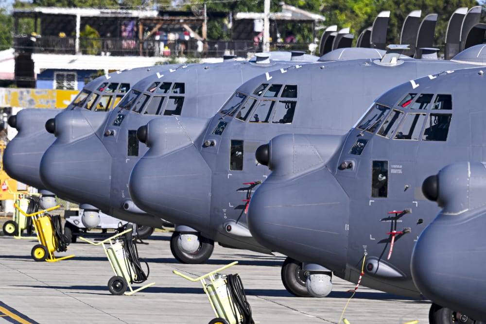 US Air Force MC-130 Hercules aircrafts sit on a tarmac on Dec. 29, 2025 at Rafael Hernandez Airport in Aguadilla, Puerto Rico. The United States has deployed a major military force in the Caribbean and has recently intercepted oil tankers as part of a naval blockade against Venezuelan vessels it considers to be under sanctions.
