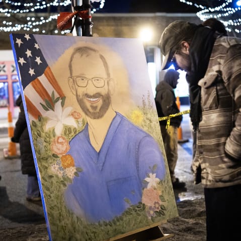 Mourners visit a memorial to Alex Pretti on January 27, 2026 in Minneapolis.