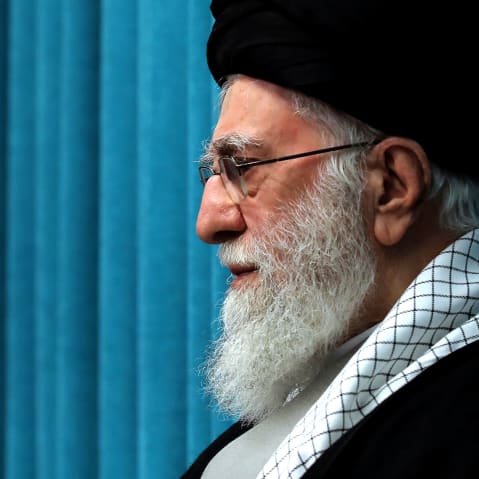 A profile view of a bearded man with a turban