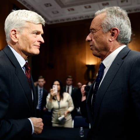 Bill Casiddy, left, talks to Robert F. Kennedy Jr. in a medium shot taken at the Dirksen Senate Office Building.