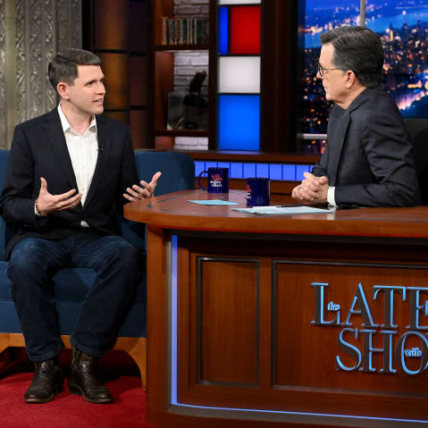 James Talarico, left, sits and talks to Stephen Colbert at The Late Show studio.