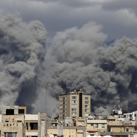 Smoke rises over Tehran, Iran, after a series of explosions on March 01, 2026.