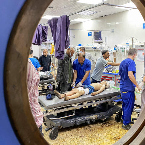 Palestinians who were injured in Israeli fire receive care at Nasser hospital in the southern Gaza Strip.