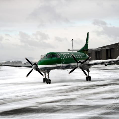 An aircraft from Key Lime Air taxies to the runway at Centennial Airport in snowy Centennial, C.O.