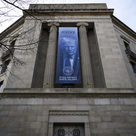 A blue banner with a photo of Donald Trump and text that says "Make America Safe Again."
