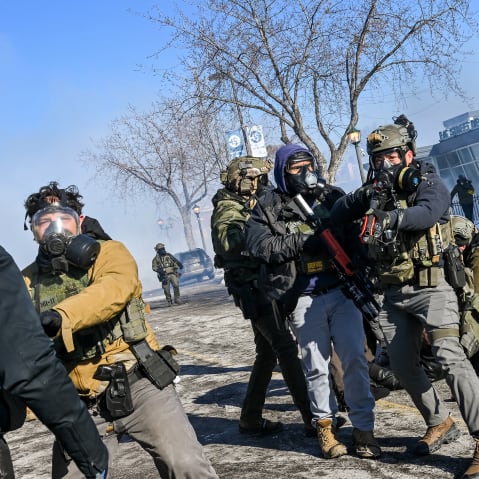 ICE agents are trying to stop protesters.