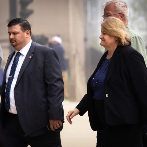 Milwaukee County Circuit Judge Hannah Dugan walks into the Milwaukee Federal Courthouse.