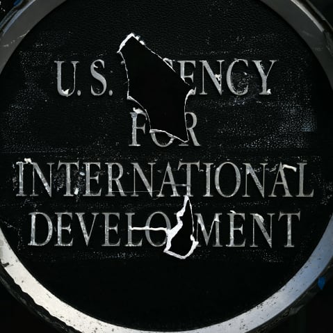 Remnants of signage for the US Agency for International Development (USAID) on the facade of the Ronald Reagan Building and International Trade Center building on Dec. 29, 2025 in Washington, D.C.