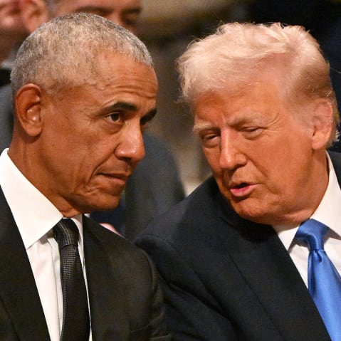 Barack Obama speaks with Donald Trump at the Washington National Cathedral.