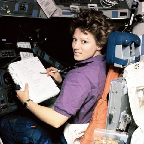 Portrait of American NASA astronaut Eileen Collins at the Pilot's Station on Shuttle Discovery.