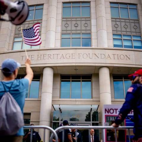 Protesters rally outside the Heritage Foundation building in Washington, D.C.