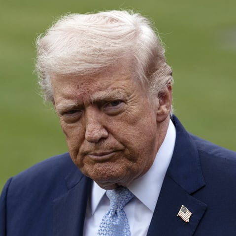 Donald Trump standing at the White House lawn.