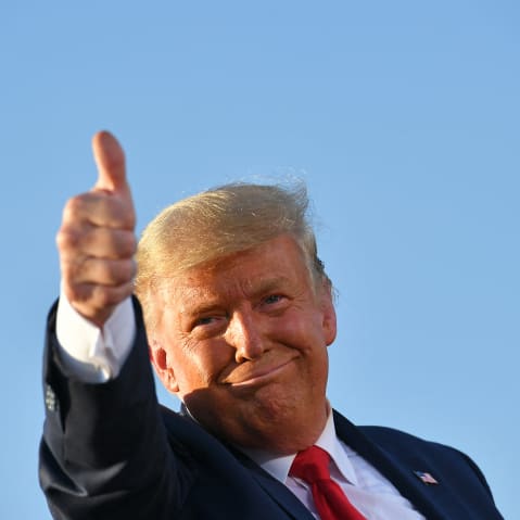President Donald Trump gives a thumbs up as he leaves a rally in Tucson, A.Z.