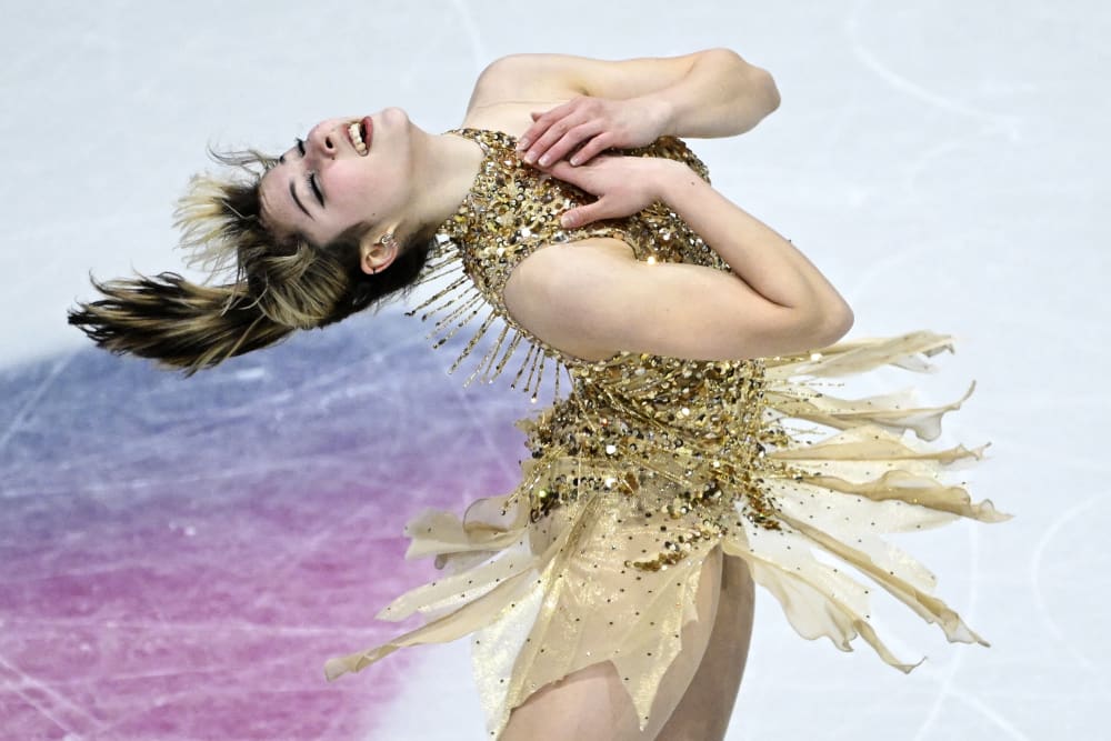 Alysa Liu bends backwards, her hands on her chest, while skating during the 2026 Winter Olympics.