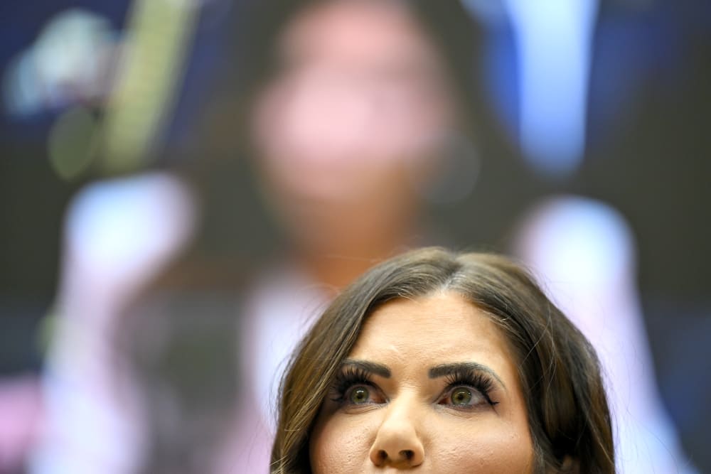 In this close up shot, only top part of Krsiti Noem's face is visible.