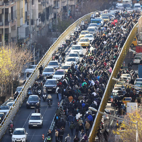 Protesters march in downtown Tehran, Iran, Monday, Dec. 29, 2025.