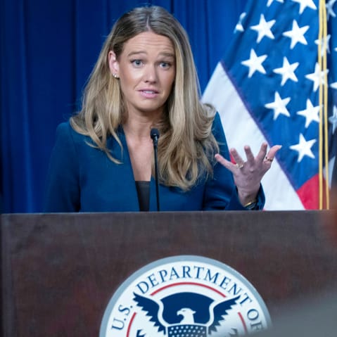 Tricia McLaughlin gestures with her hand as he speaks during a presser.