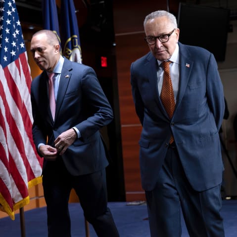 Hakeem Jeffries, left, Chuck Schumer walk out of a presser.