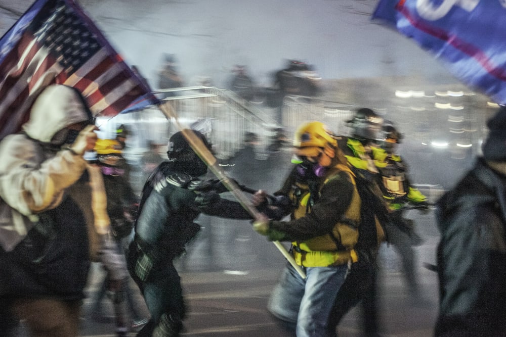 Capitol Police and MPD using physical force and tear gas to force the Trump supporters further away from the U.S Capitol on Jan. 06, 2021.