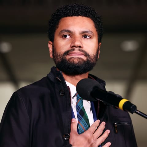 Maxwell Frost with his hand on his chest.