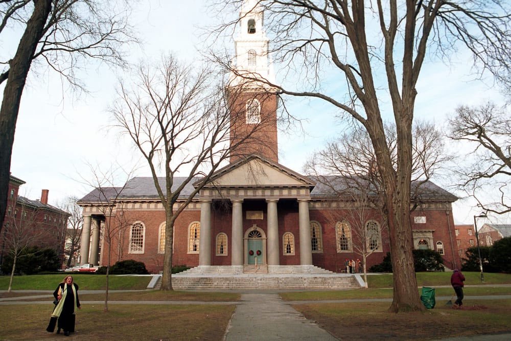 People walk around the Harvard University''s main campus.