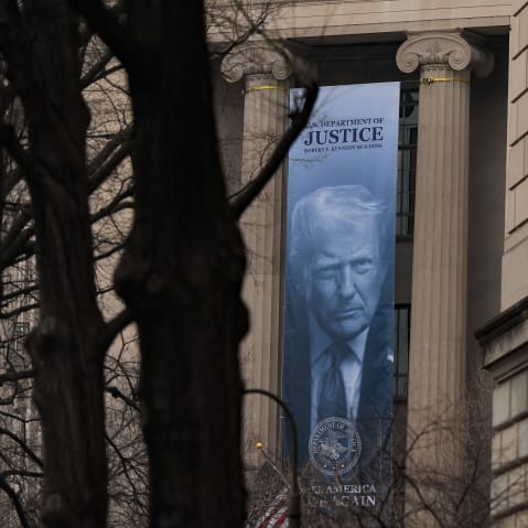A banner of President Donald Trump hung on the Department of Justice.