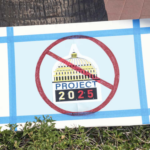 An anti-Project 2025 sign in front of Tucson's Federal Building in Arizona.