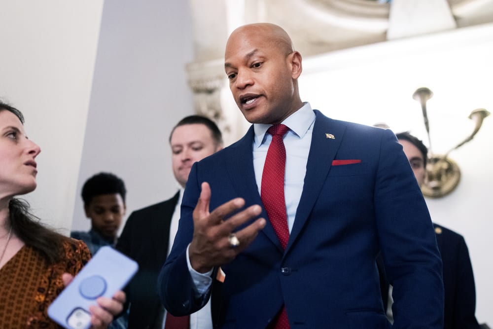 In this photo shot from below, Wes Moore talking to reporters.