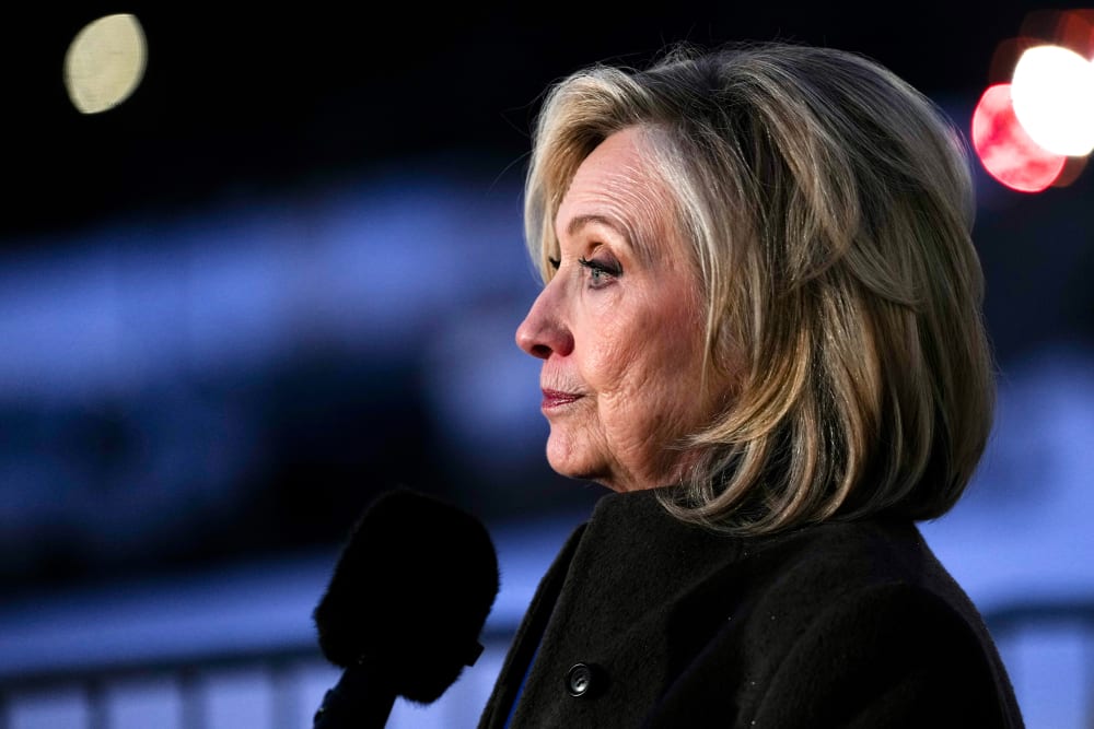 Hillary Clinton is seen from the side as she speaks to the press in this closeup shot.