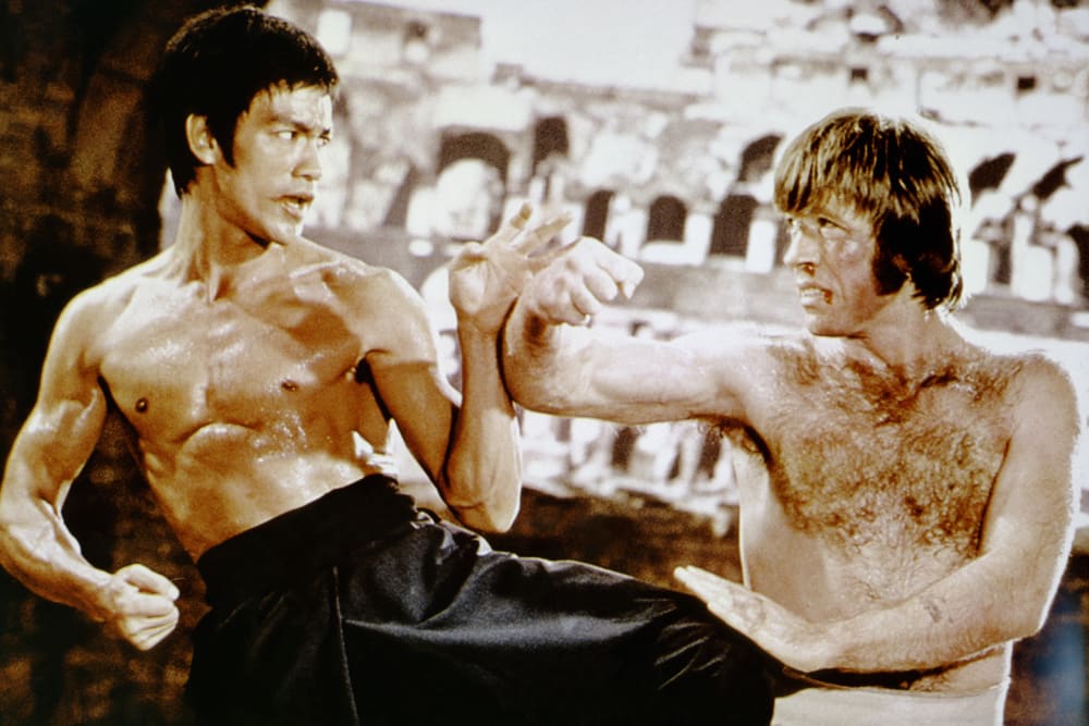Bruce Lee, left, and Chuck Norris practice martial arts.