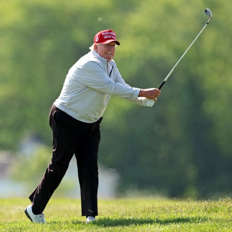 Donald Trump playing golf.
