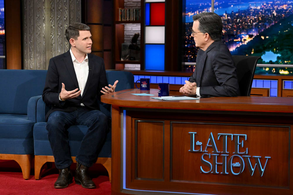 James Talarico, left, sits and talks to Stephen Colbert at The Late Show studio.