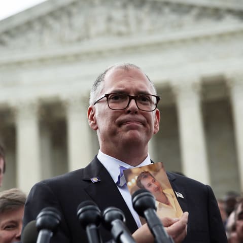 Plaintiff Jim Obergefell holds a photo of his late husband, John Arthur, as he speaks to members of the media on June 26, 2015, in front of the Supreme Court.