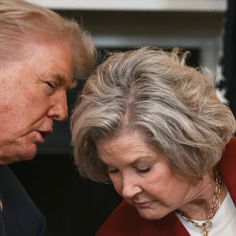 President Donald Trump leans in to speak with White House Chief of Staff Susie Wiles at the White House.