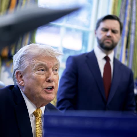 President Donald Trump speaks to the media as Vice President JD Vance listens in the Oval Office of the White House.