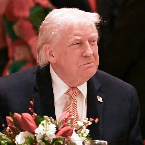 US President Donald Trump attends a Christmas dinner on Dec. 24 at his Mar-a-Lago resort in Palm Beach, FL.
