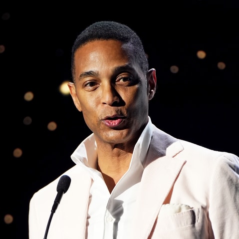 Don Lemon behind a microphone.