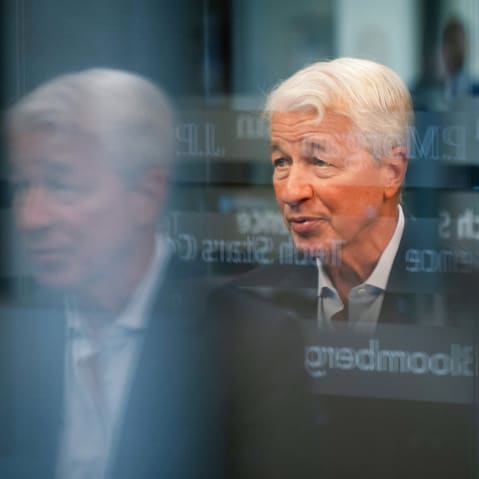 Jamie Dimon with reflections from the glass overlayed in front of him.