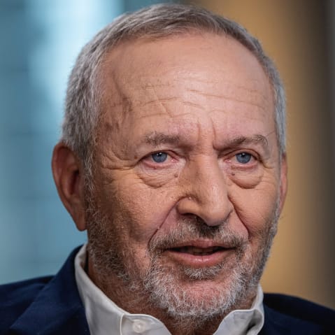 Larry Summers face is seen in a very closeup shot.