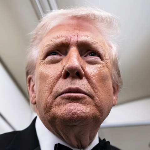 President Donald Trump speaks to reporters and members of the media on board Air Force One while flying in between Washington and West Palm Beach, Fla.