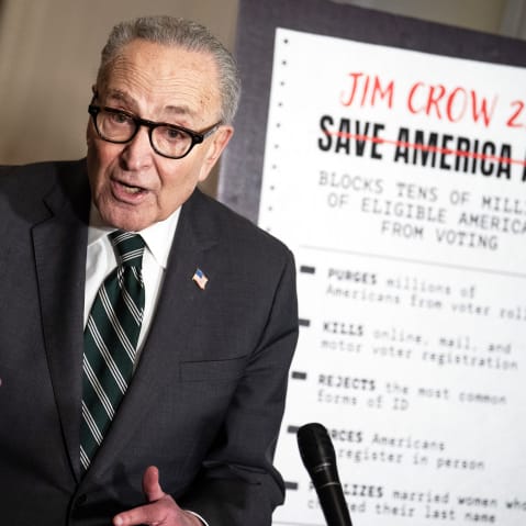 Charles Schumer conducts a news conference.