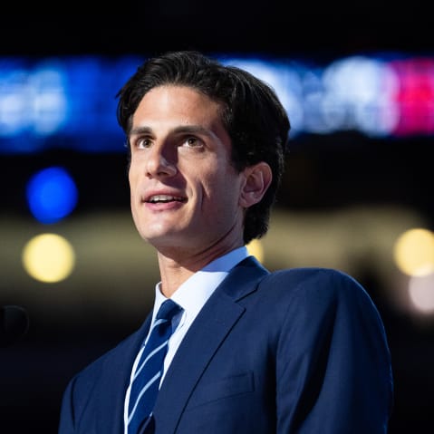 Jack Schlossberg behind a podium with a microphone.