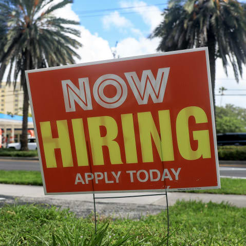 A “Now Hiring” sign is posted outside a business on Oct. 3, 2025, in Miami.