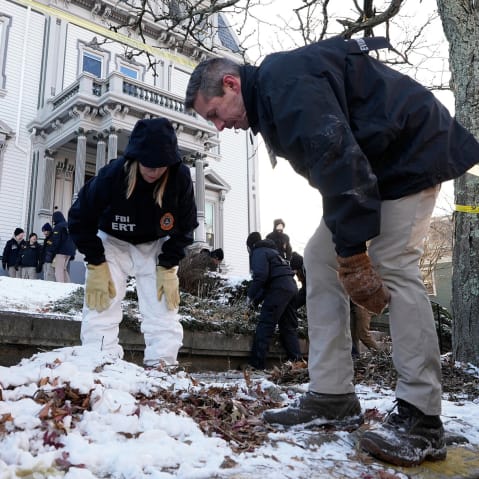 Members of the FBI Evidence Response Team search for evidence near Brown University.