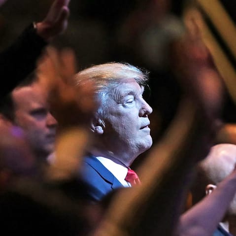 Donald Trump attends a worship service.